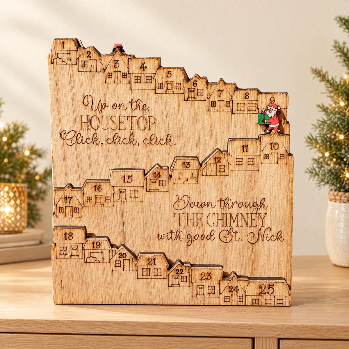 Natural wooden countdown board styled on an ivory Christmas console