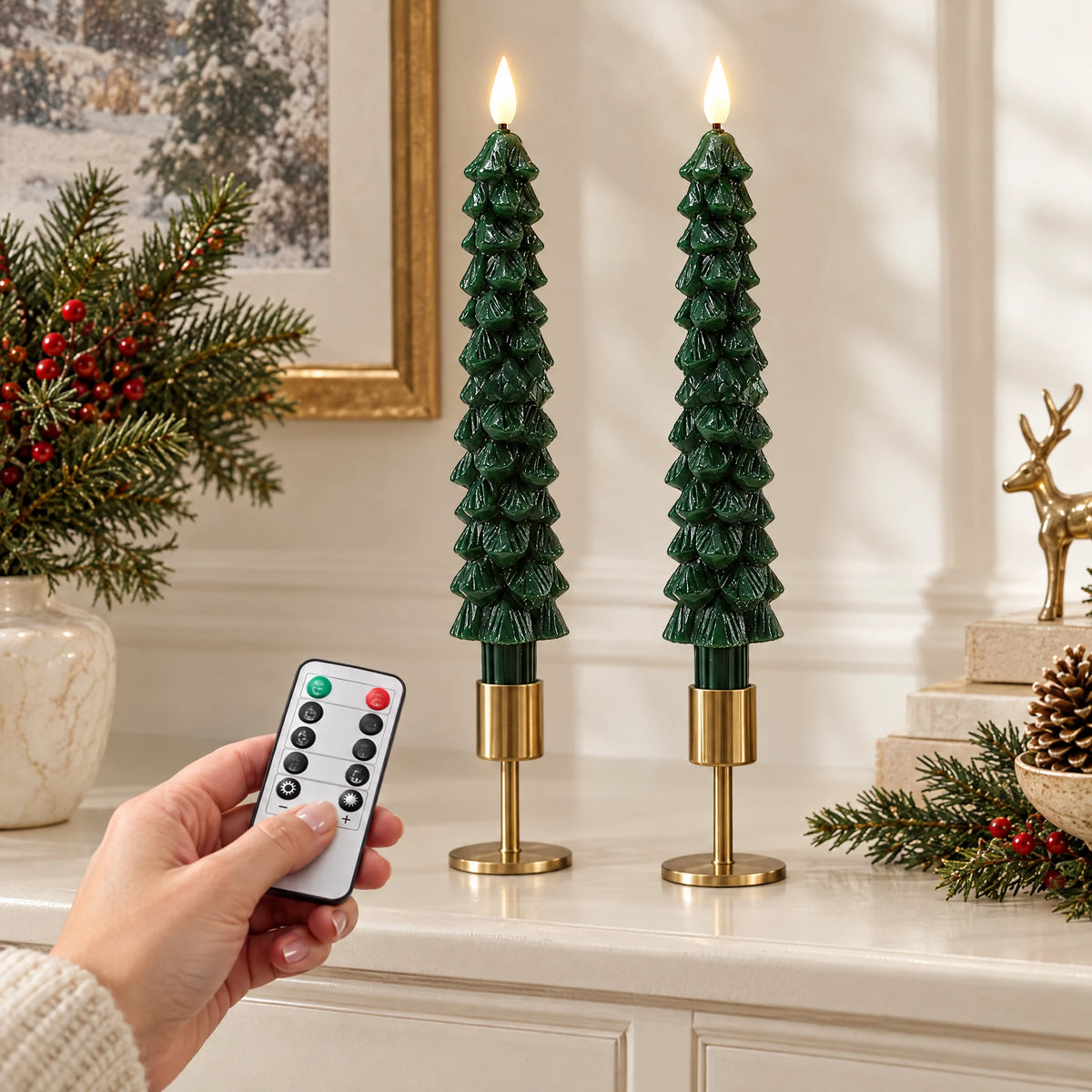 Hand holding included remote beside two green LED taper candles; holders are styling props
