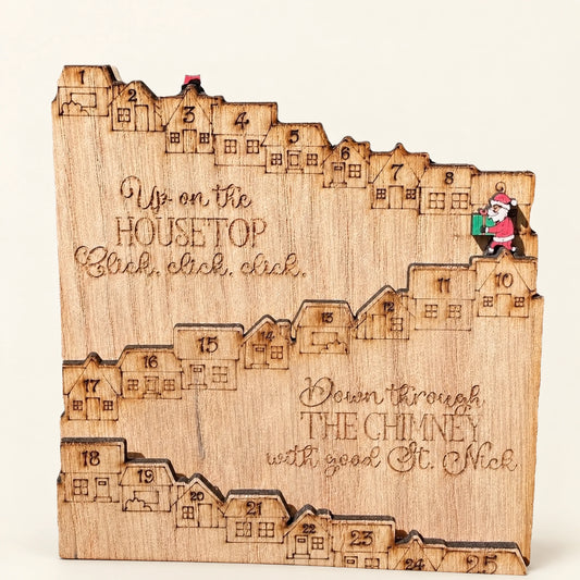 Natural wooden Christmas countdown board with Santa marker and numbered houses