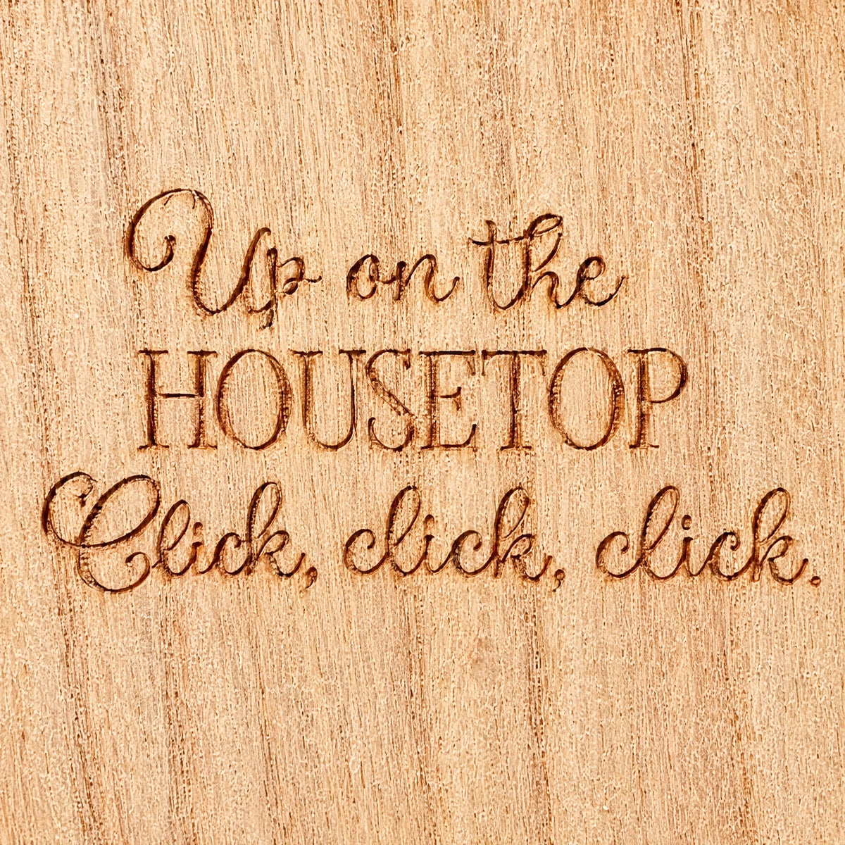 Close-up of the engraved lettering on the natural wooden advent calendar