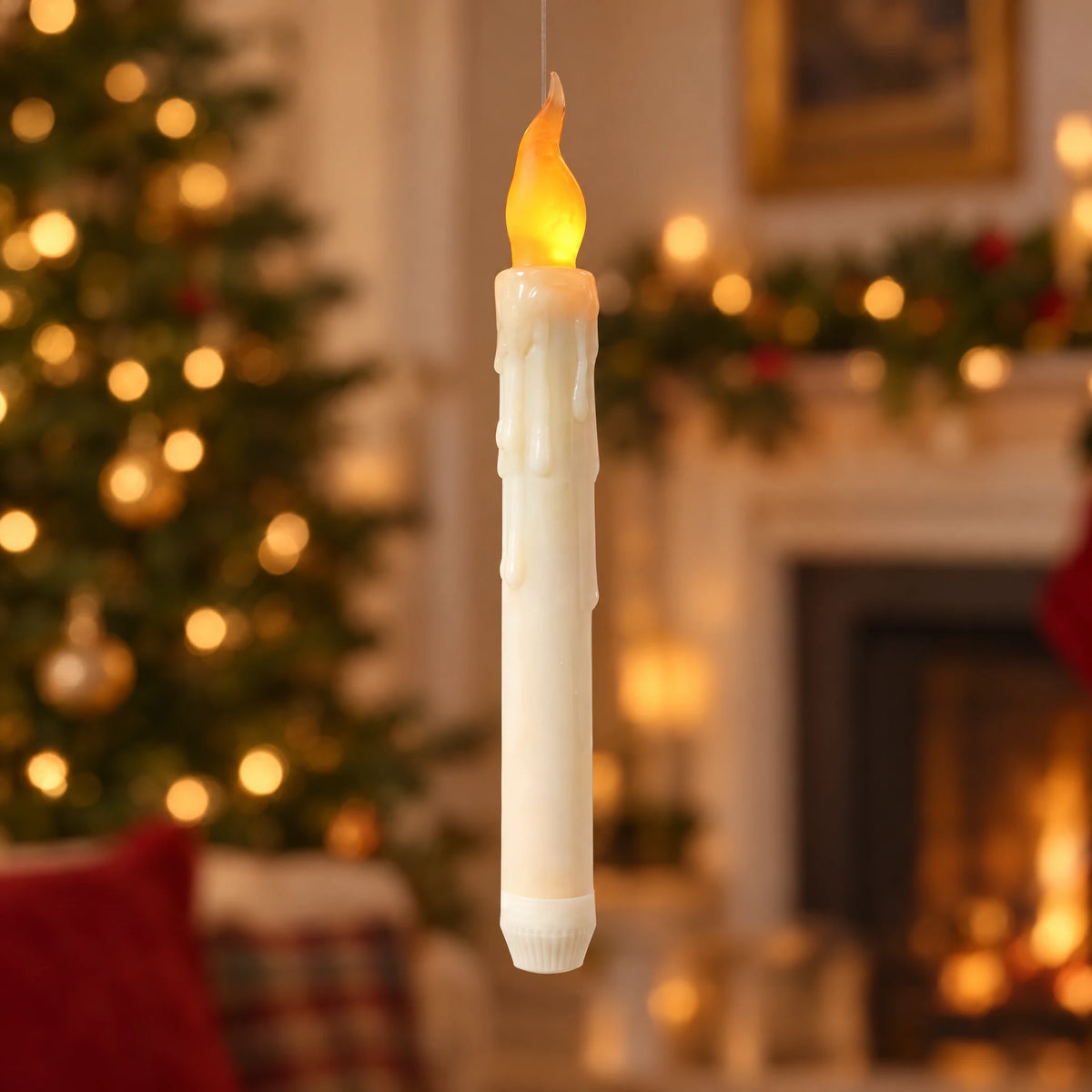 Close-up of ivory floating LED candle and amber flame-shaped light